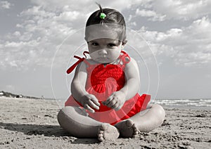 Serious child with a red dress