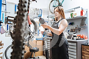 Serious concentrated craftswoman weighting details in the workshop