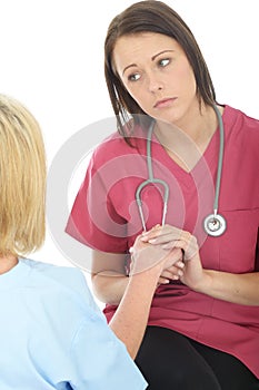 Serious Concerned Young Professional Female Doctor Having A Conversation With A Patient