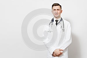 Serious confident experienced handsome young doctor man isolated on white background. Male doctor in medical gown, shirt