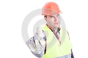 Serious constructor doing refusal gesture