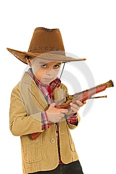 Serious cowboy holding weapon toy
