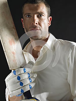 Serious Cricket Player With Bat