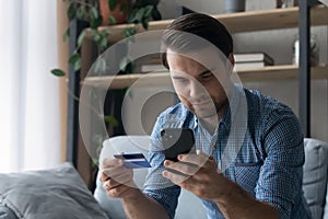 Serious customer making payment by credit cards