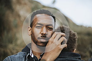 Serious dad with his son outdoors