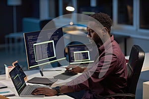 Serious developer working with computer program