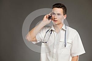 Serious doctor on the phone