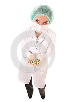 Serious doctor with pills