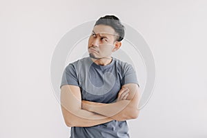 Serious and doubt face of man thinking of something stand isolated on white