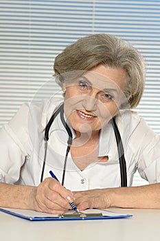 Serious elderly woman doctor