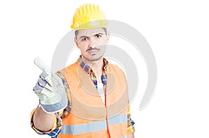 Serious engineer doing no or denial gesture with his finger