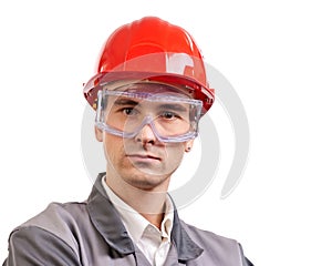 Serious engineer in red hardhat