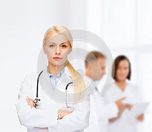 Serious female doctor with stethoscope