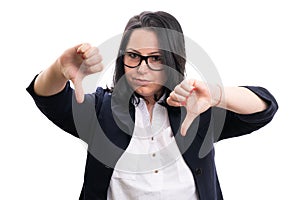 Serious female manager making thumbs-down dislike gesture
