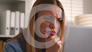 Serious girl frown puzzled stressed Caucasian woman looking at computer monitor problem business failure bad news