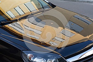 Serious hail storm damage on a parked car. Dented and damaged car after hailstorm