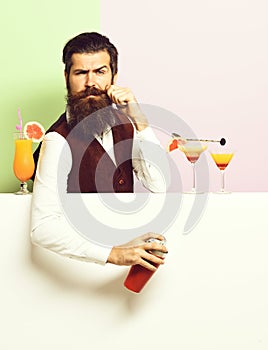Serious handsome bearded barman