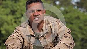 Serious Hispanic Male Soldier Talking Wearing Camo