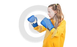 serious kid boxer in boxing gloves ready to fight and punch isolated on white, self-defense