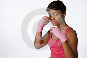 Serious looking woman fighting against breast cancer