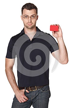 Serious male showing red card in hand