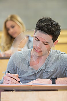 Serious male student during class