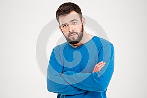 Serious man with arms folded