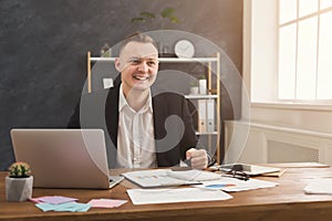 Serious man office worker is reading report