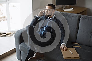 Serious Man in Talking on Smartphone