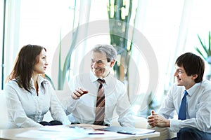 A serious meeting of business men at the office. Discussion team in the office