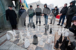 Serious men play chess outdoor