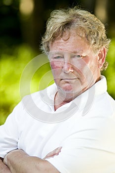 Serious middle age senior tennis player male