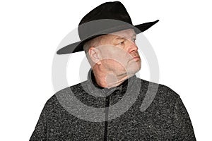 Serious Middle-Aged Caucasian Man in Worn Cowboy Hat looking to the Side - Isolated Portrait on White Background