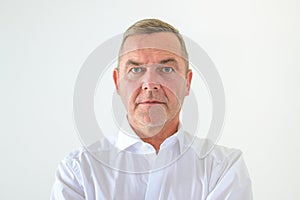 Serious middle-aged man with deadpan expression
