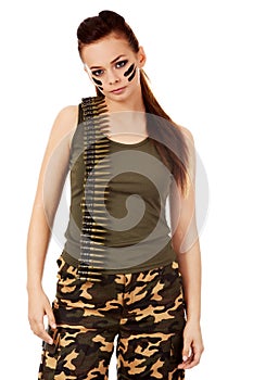 Serious military woman with bullet belt