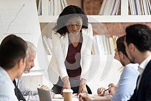 Serious millennial black businesswoman head company briefing in office