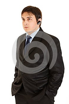 Serious modern businessman with handsfree