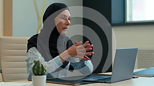 Serious Muslim woman Arabian islamic businesswoman in hijab female employer leader coach consultant girl talk video call