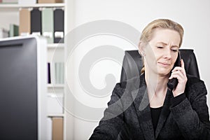 Serious Office Woman Chatting to Someone on Phone