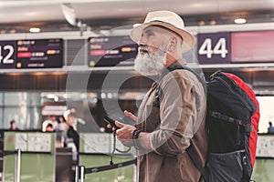 Serious old man holding bible in hand