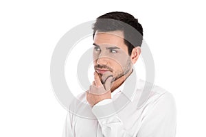 Serious and pensive isolated young businessman looking sideways.