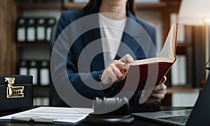 Serious pensive lawyer working at desk in office