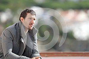 Serious pensive man contemplating views in winter photo