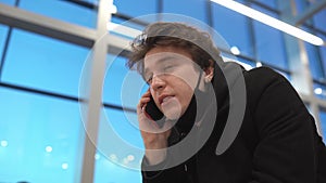 Serious portrait of student tourist freelancer business man voice recognition audio message speech phone smartphone call