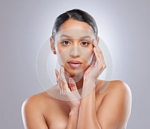 Serious, portrait and woman with skincare in studio for natural beauty, spa treatment and cosmetics. Female person