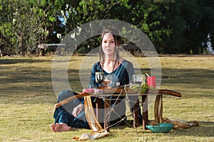 Serious Priestess with Pagan Altar