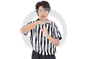 Serious referee showing time out sign photo