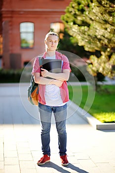 Serious or sad young student in University campus