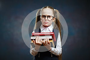 Serious Schoolgirl Wear Glasses Hold Pile of Book
