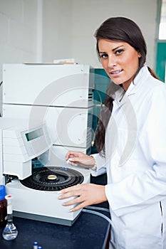 Serious scientist using a centrifuge